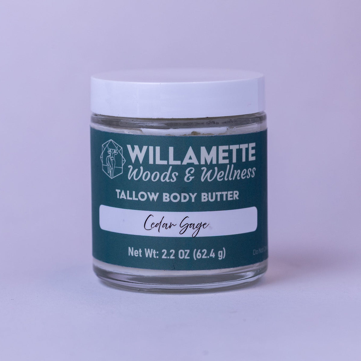 Jar of Willamette Woods & Wellness tallow body butter on a light purple background