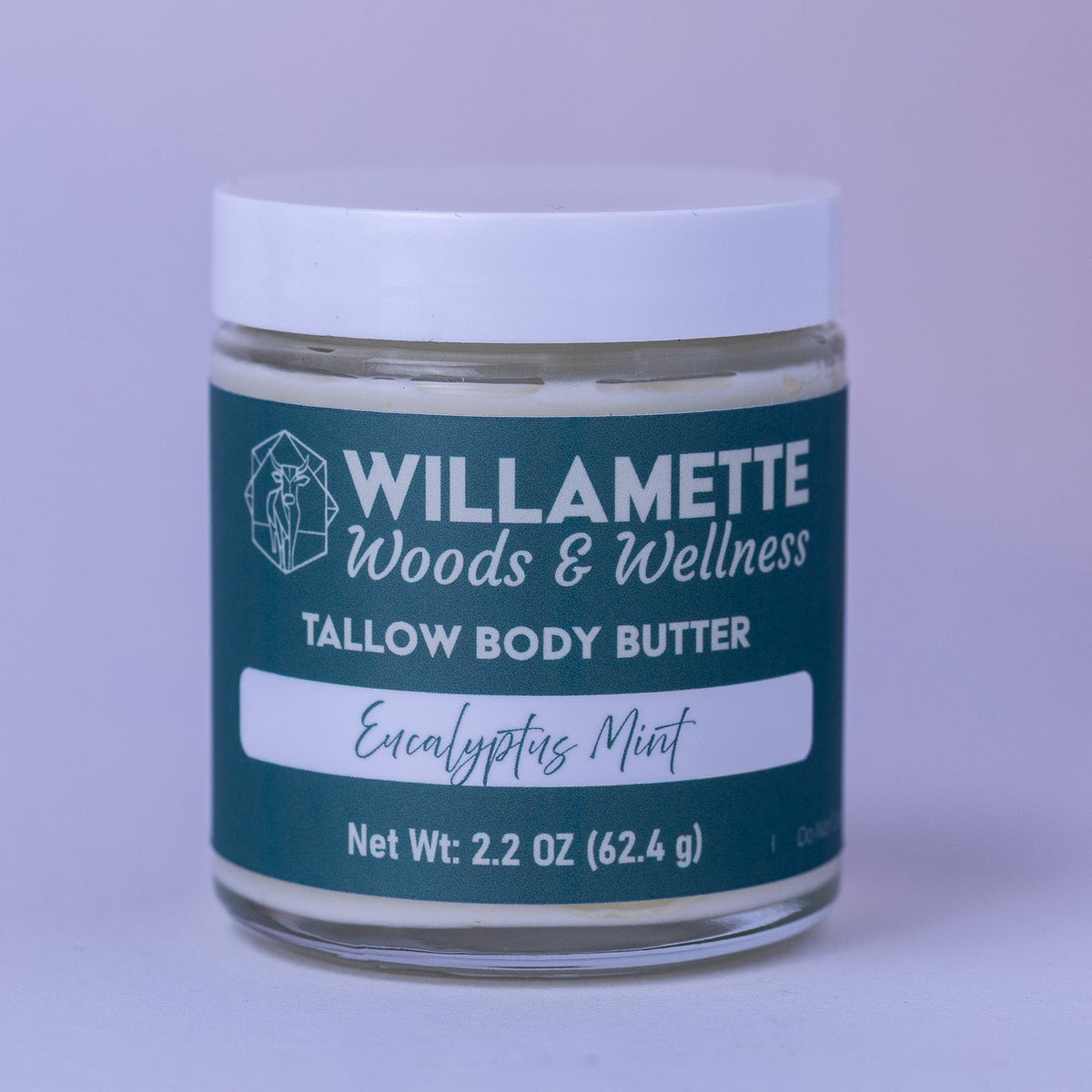 Jar of Willamette Woods & Wellness tallow body butter on a light purple background
