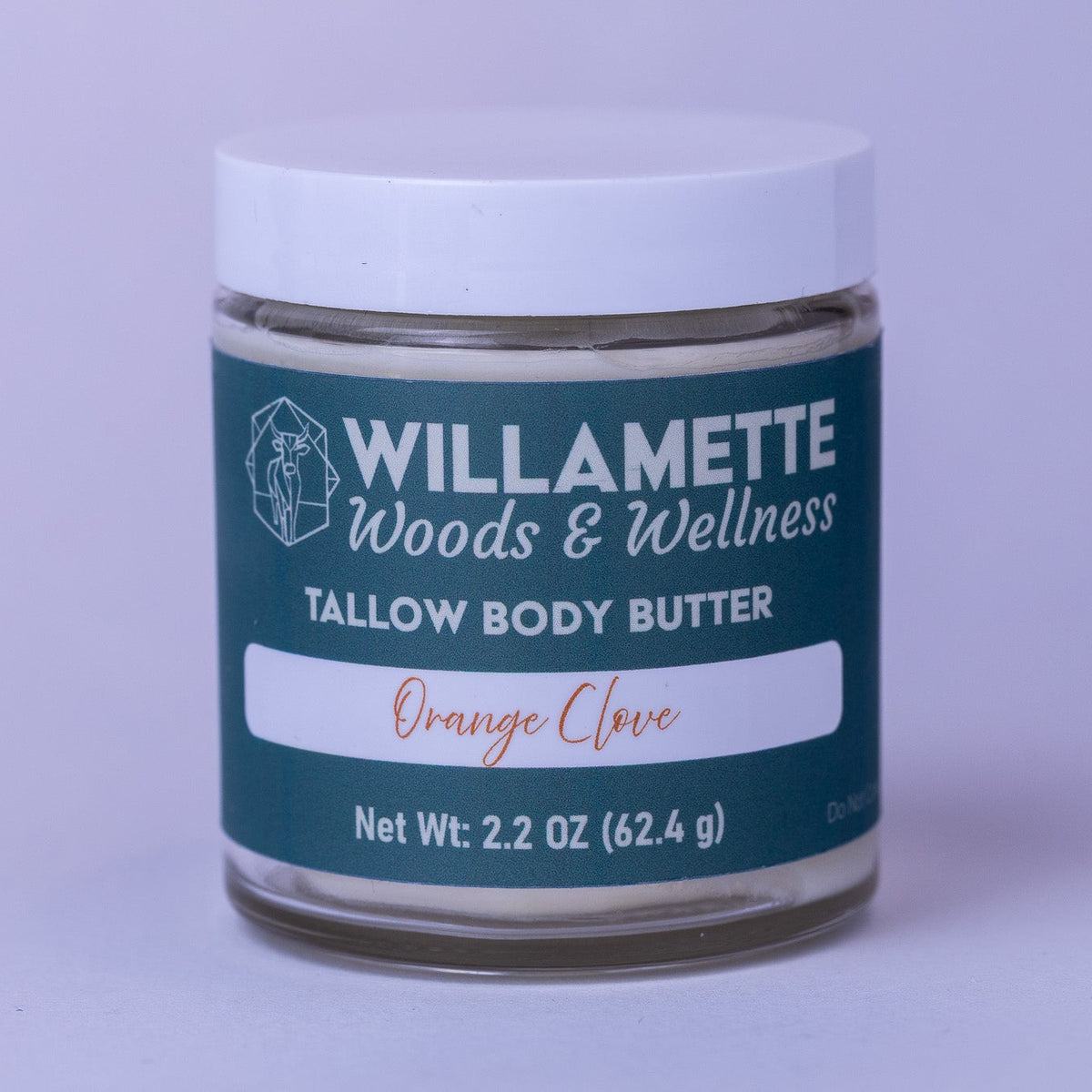Jar of Willamette Woods & Wellness tallow body butter on a light purple background