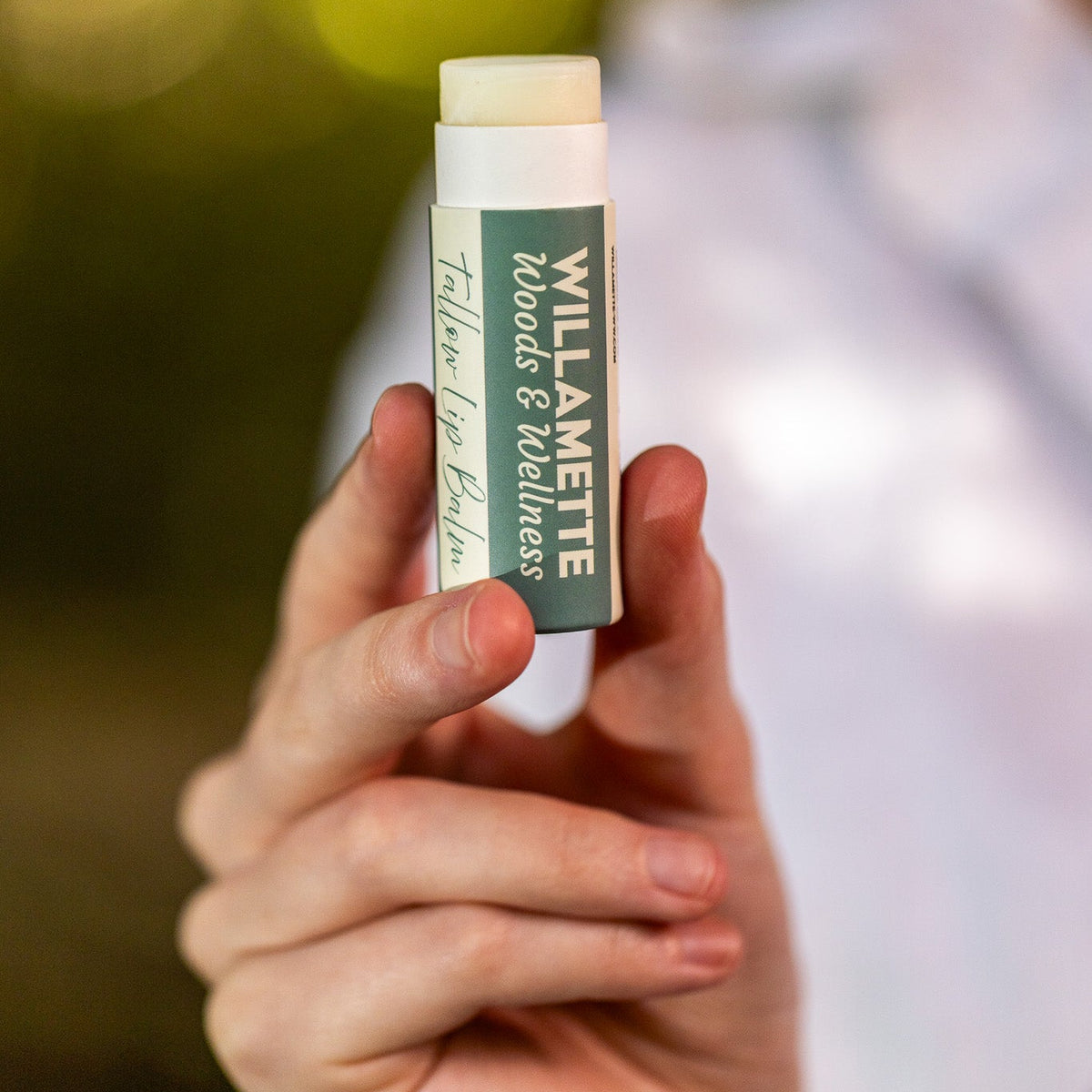 Lip Balm Tube in a Woman's Hand